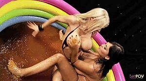 Two british blondes engage in sloppy lesbian sex in a jelly-filled pool, stimulating each other passionately
