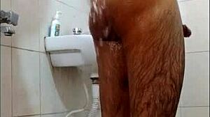 Guy feels intense pleasure masturbating in shower, reaching orgasm