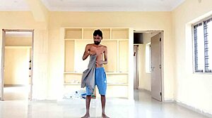 rajesh strips and masturbates, moaning while cumming in cup