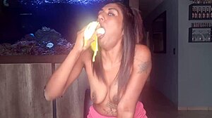 Topless Desi Squeezes Boobs While Sucking and Deepthroating Banana Kinkily