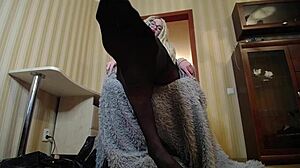 She makes him smell her feet in nylon stockings after a long day at work, teasing with femdom control.