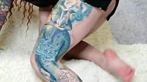 Hot tattooed girl in dress and socks indulges in detailed foot fetish activities.