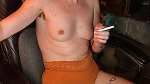 sat down to smoke without a bra. asian cigarette fetish in naked sexy pose.