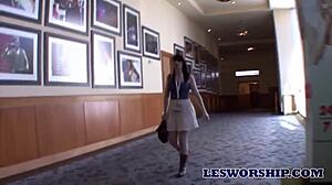 Busty MILF spots teen at porn show and licks her big tits