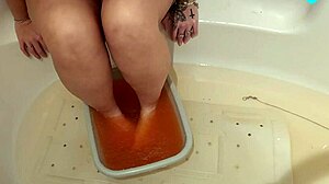 blonde milf with natural tits and big ass performs solo feet sploshing fetish.