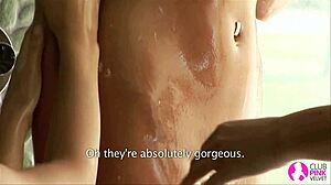 Brunette in threesome kisses and licks while fingering on bed