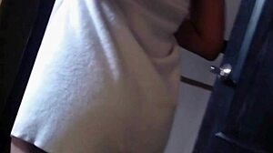 In the shower, she fingers her pussy, embracing her slutty nature with big tits.