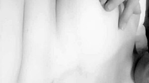 this busty milf is caressing her big tits in a homemade close-up, she's reaching orgasm