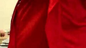 Brunette in red lingerie plays with herself?