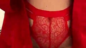 Brunette in red lingerie plays with herself?