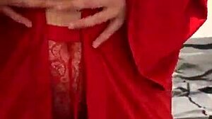 Brunette in red lingerie plays with herself?