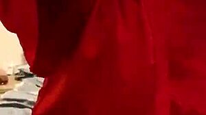 Brunette in red lingerie plays with herself?