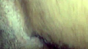 Amateur couple engages in doggystyle position.