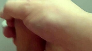 handjob on table with big load on small dick