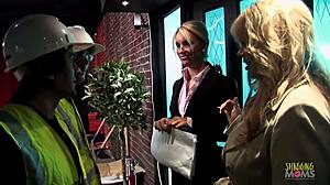 Construction workers have group fun with a couple of beauties and give them rewards.