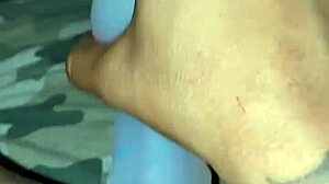 Ebony slut stuffs her pierced pussy with a pretty dildo in solo masturbation session