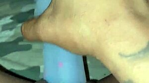 Ebony slut stuffs her pierced pussy with a pretty dildo in solo masturbation session