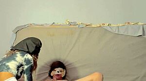 Dominatrix engages in assplay and fingering with submissive guy