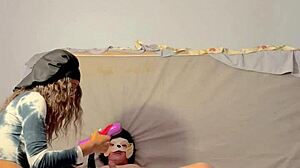 Dominatrix engages in assplay and fingering with submissive guy