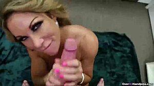 Mature milf gives pov handjob to big cock