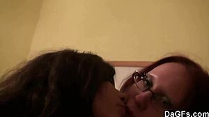 two teen lesbians play with camera in bedroom