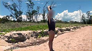 wife dares to play football nude on clothed public beach
