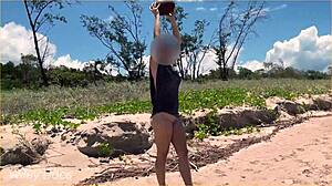 wife dares to play football nude on clothed public beach