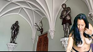 Queen undressing for butler in castle striptease