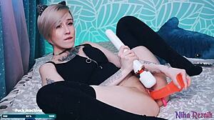 I use a big red dildo on my shaved ass and cum with my big tits