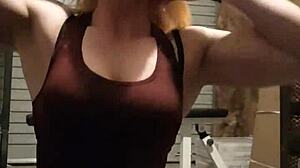 Blonde milf bodybuilder undresses teasingly in gym, ripping leggings