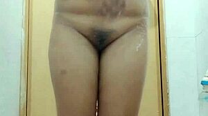 Sensual Filipina showers soaping big boobs in homemade video.