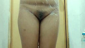 Sensual Filipina showers soaping big boobs in homemade video.