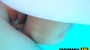 This mommy is doing it again outdoors with her natural tits and shaved pussy on display for all to see