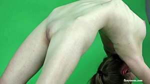 Young gymnast Anna Mostik spreads legs wide