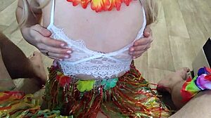 Wife gives blowjob to husband at Hawaiian party with kissing and licking.