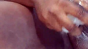 Ebony beauty feels intense pleasure squirting in solo session