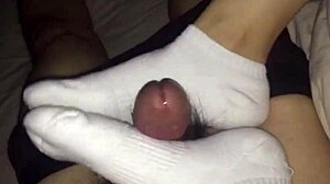 female colleague in white socks gives footjob until cum