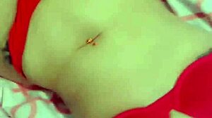 Puerto Rican redhead Latina babe shows off tits and ass in red bikini