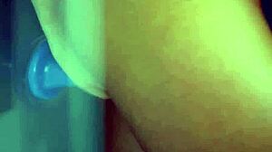 two attractive babes fucking blue dildo while licking each other.