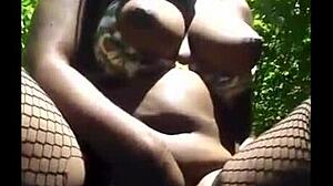 Hey, that masked girl is masturbating outside in lingerie.