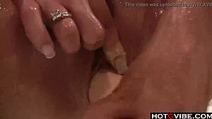 hot brunette masturbates in bathtub with toys