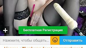 a chubby redhead chats and performs on webcam, showing off her curves.