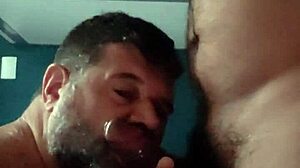 Kneeling gay guy sucks and waits for cum