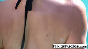 Exciting home movie of hot blonde Nikita masturbating her big tits and pussy!