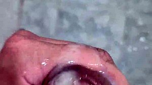 Watch the twink get a handjob and cum in the shower