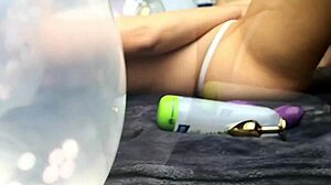 ursula masturbates with dildo and plug among balloons
