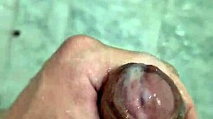 Watch the twink get a handjob and cum in the shower