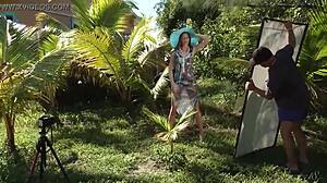 Sexy teen poses naked in hat and dress outdoors