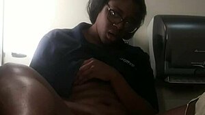 Ebony babe masturbates on bathroom counter, fingering her big ass close-up.