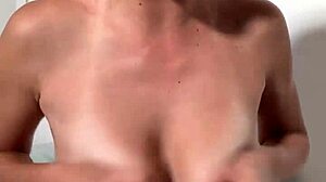 stella cardo teasingly shows off her huge natural tits in a cute way